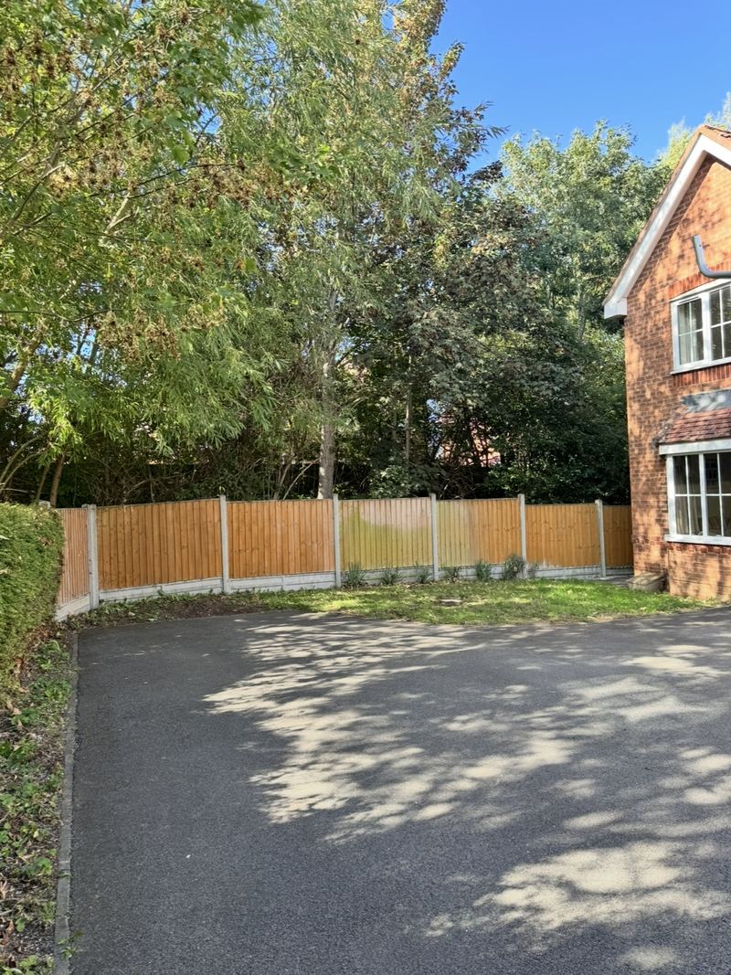 After: the same spot with the tree removed, leaving the wooden fence and driveway clear, Newbold and Brownsover, Rugby
